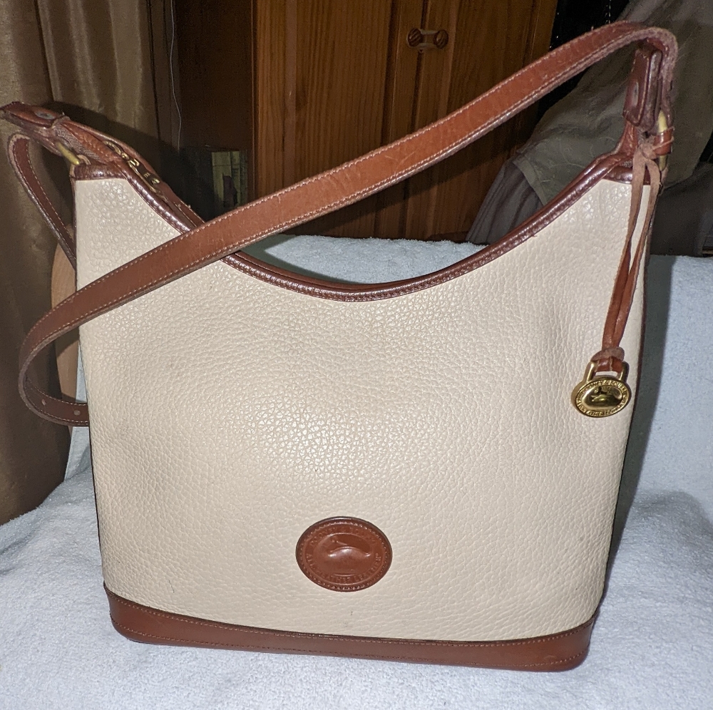 Vintage Dooney and Bourke all weather cream and brown leather trim shoul…